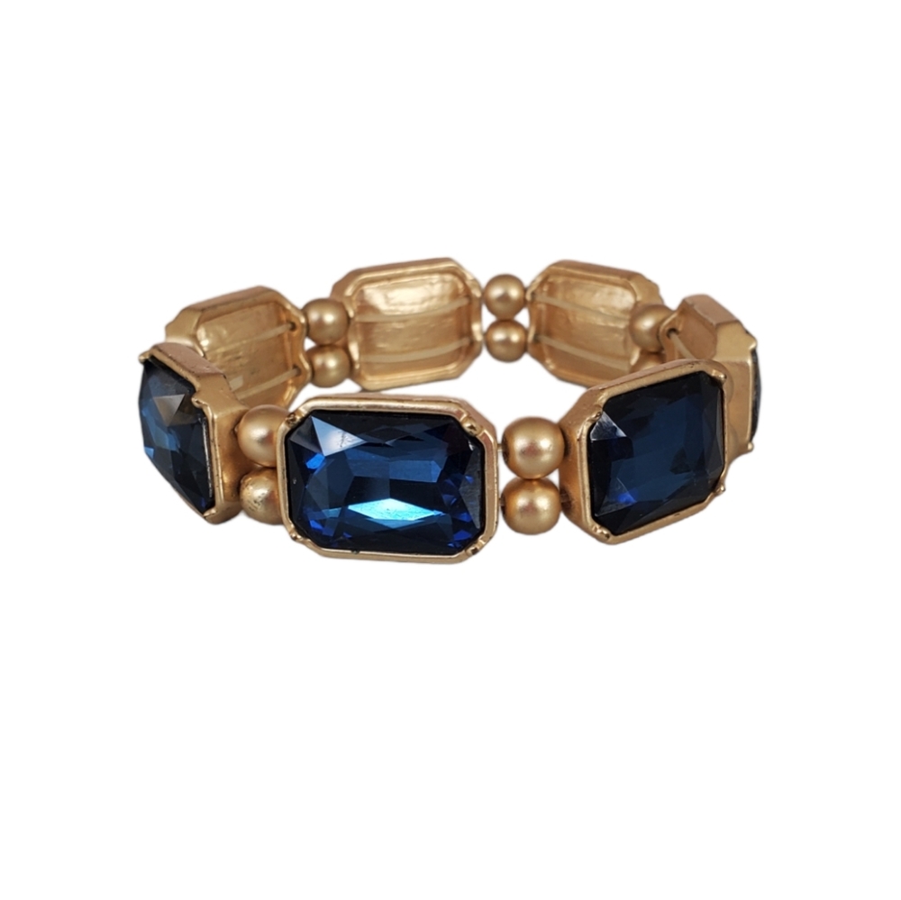 Gold toned stretch bracelet with blue stones